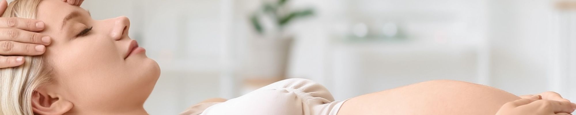 A pregnant woman enjoying a Sugar Land prenatal massage
