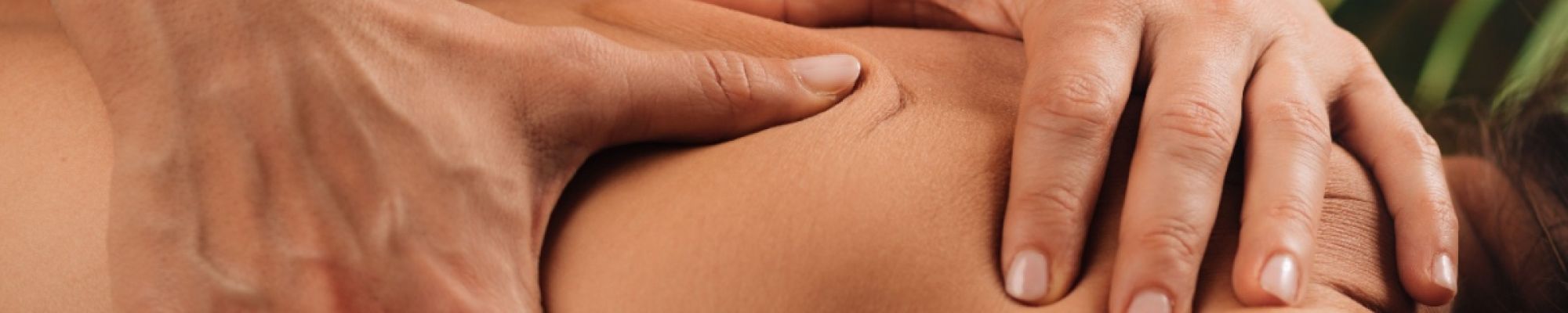 A massage therapist performing Houston deep tissue massage