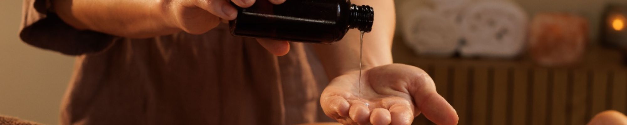 A massage therapist using oils